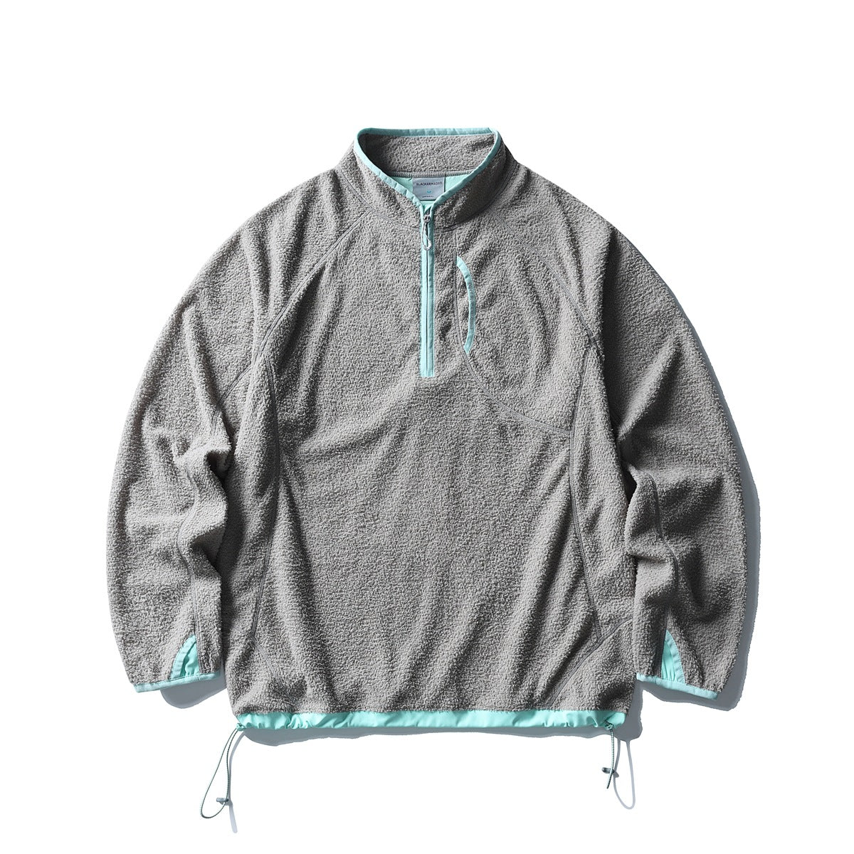 Gray textured fleece-like half-zip pullover with mint contrast trim and drawstring hem, flat lay front view