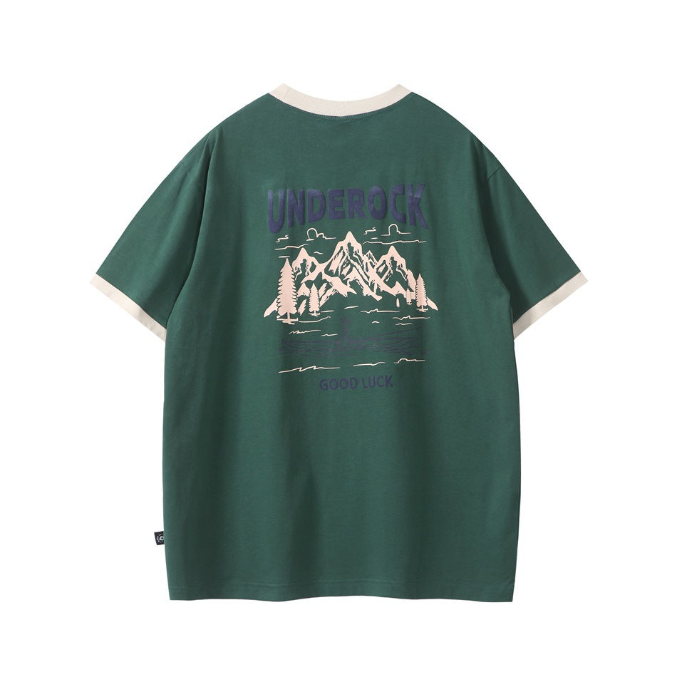 Green short-sleeve T-shirt back with cream collar and cuffs and mountain graphic printed in cream and navy