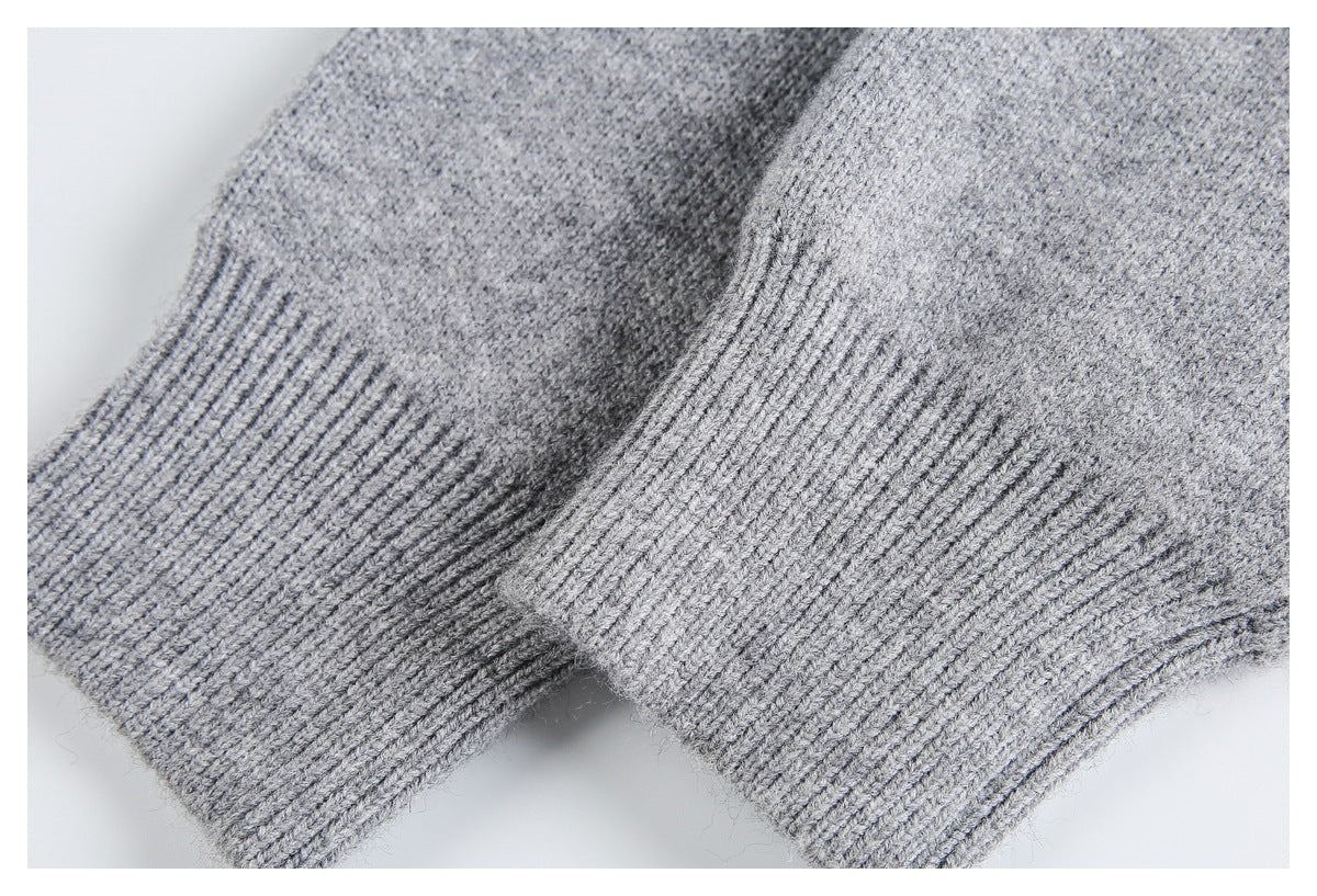 Close-up of two heather gray knit cuffs with ribbed edges.
