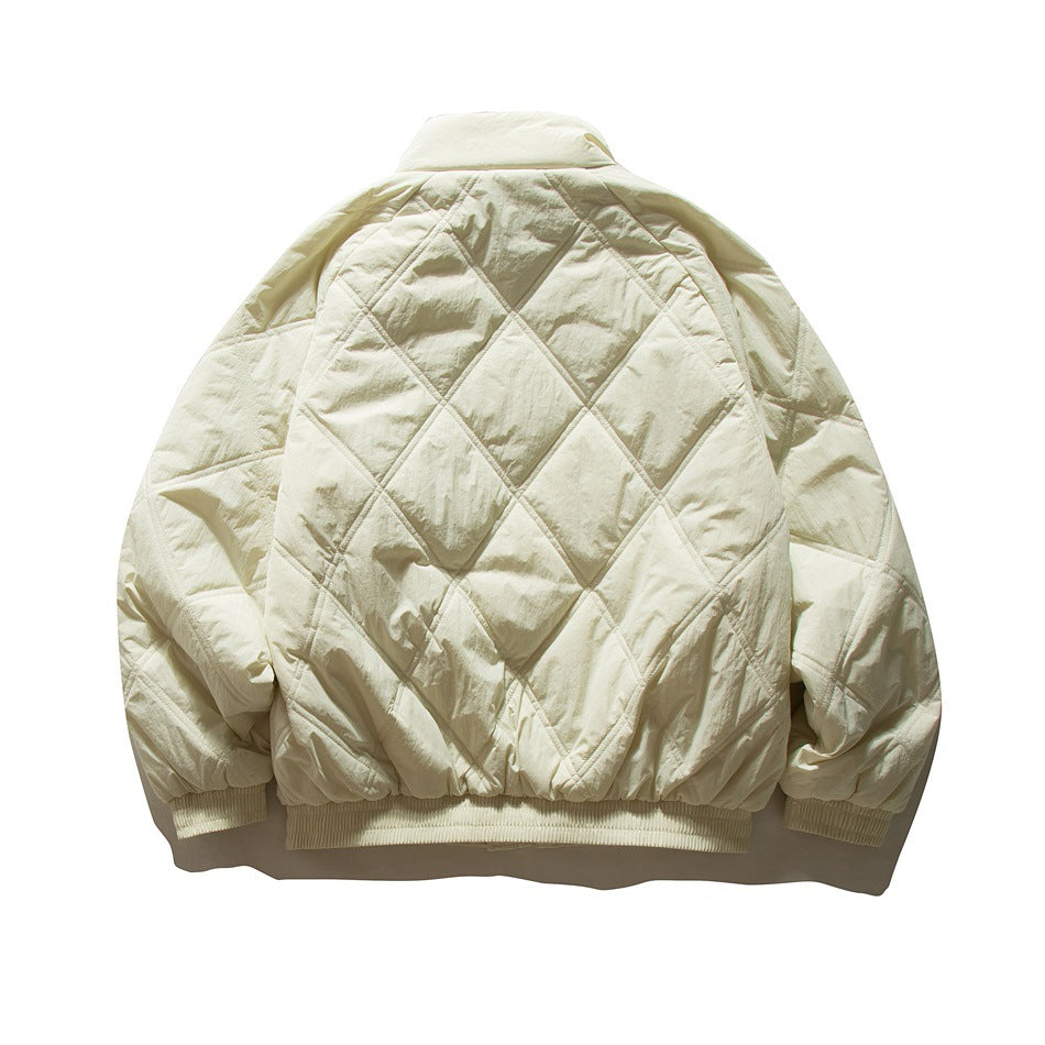 Back view of beige-cream diamond-quilted jacket with stand collar and ribbed cuffs and hem