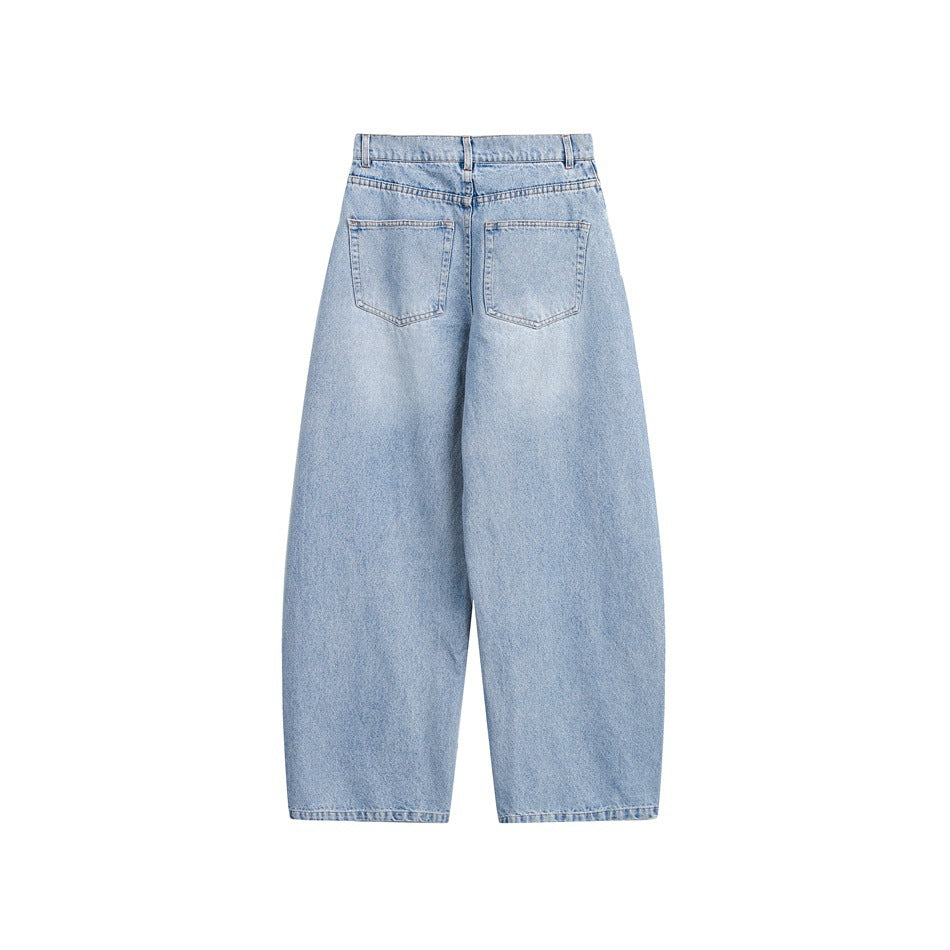 Back view of light-wash blue jeans with a high waist, belt loops, two back pockets and wide straight legs.