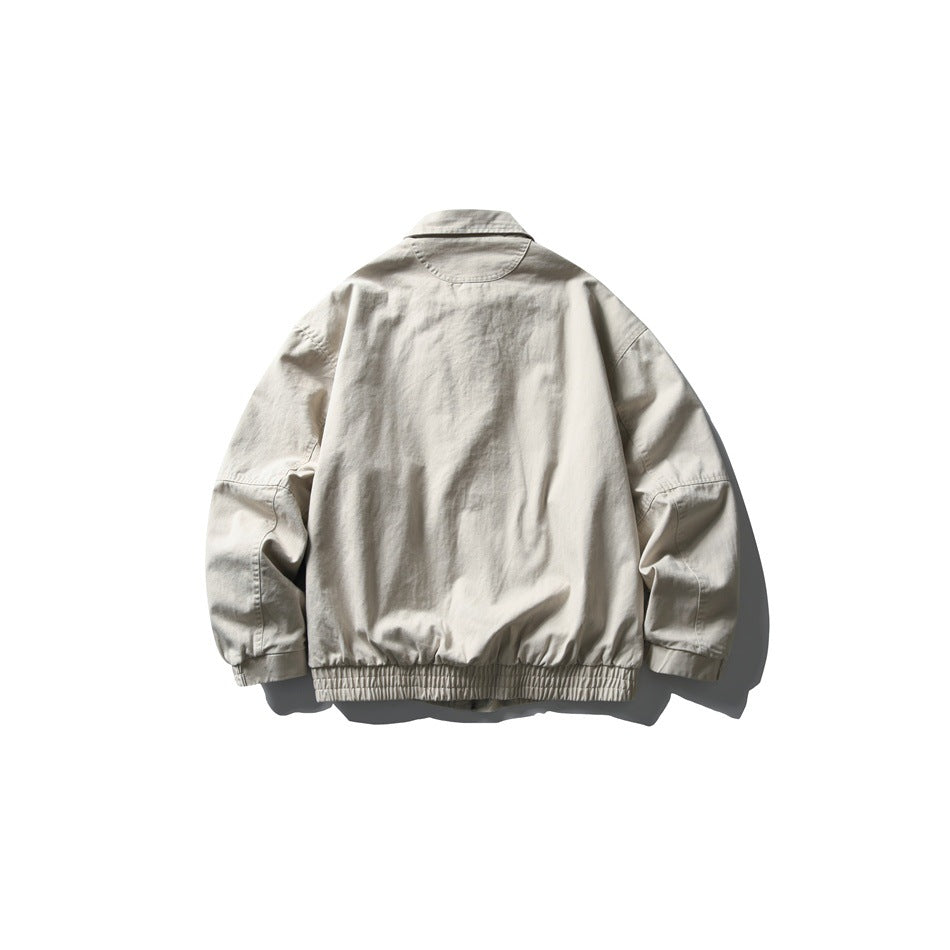 Back view of an off-white collared jacket with long sleeves and a gathered elastic hem.