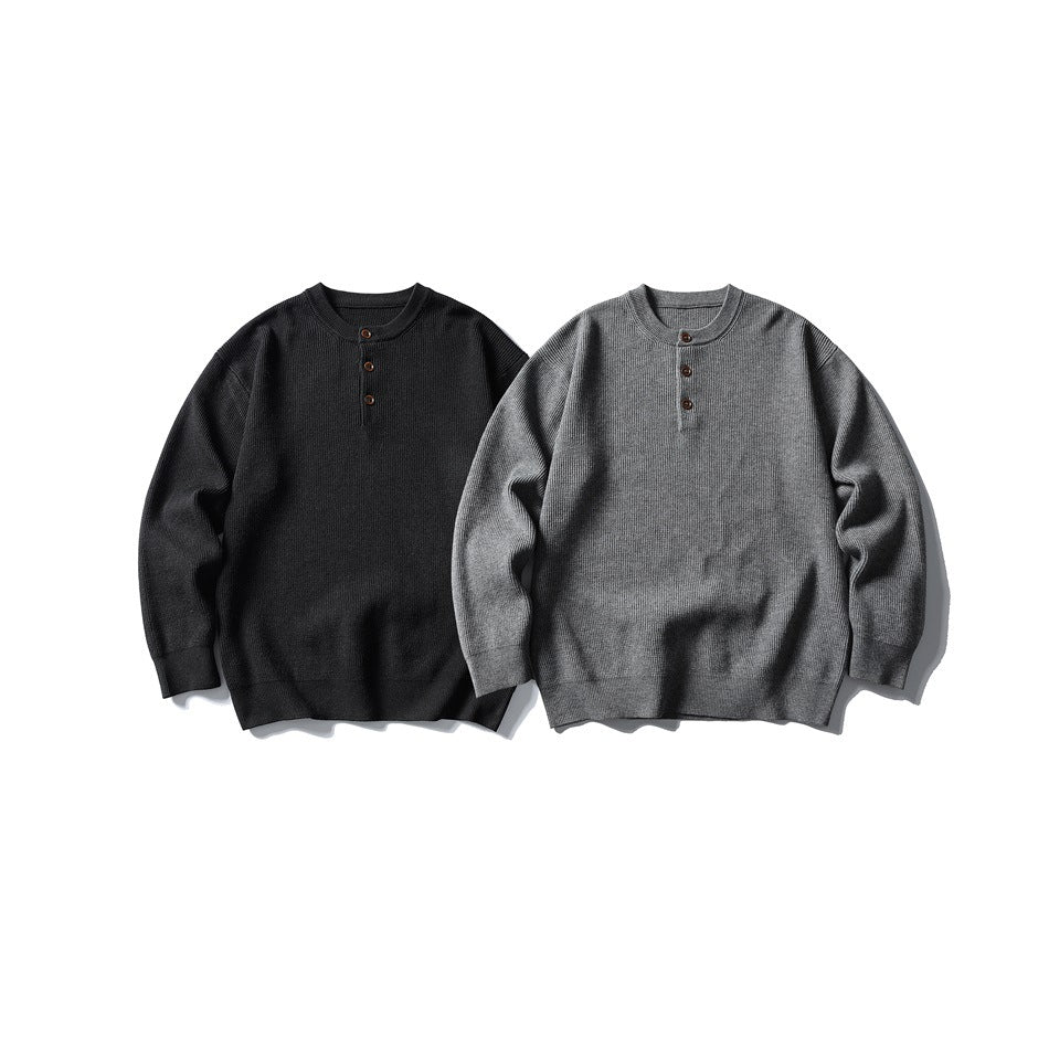 Two long-sleeve rib-knit henley sweaters shown from the front in charcoal and gray.