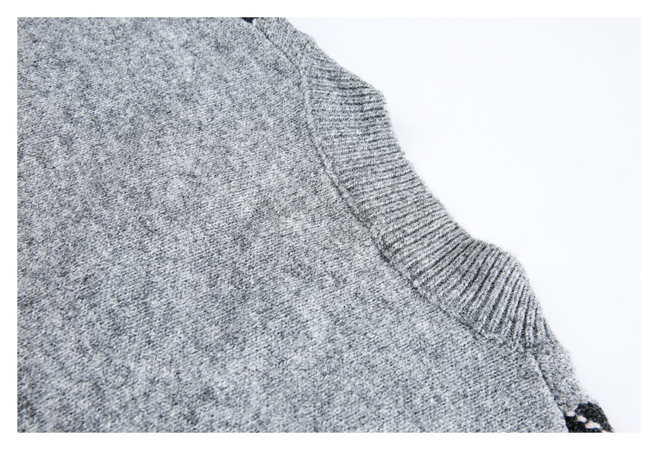 Close-up of the ribbed neckline and gray marled knit fabric.