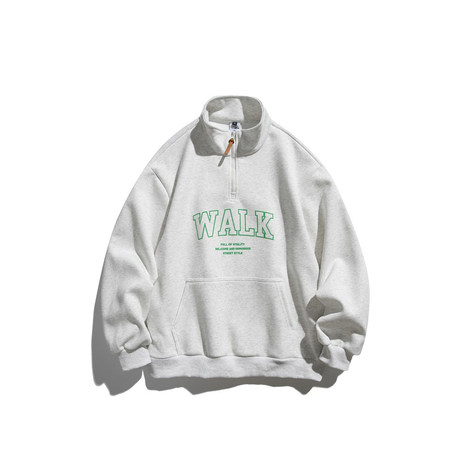 Light heather gray half-zip stand-collar sweatshirt with green outlined WALK print and front pouch pocket