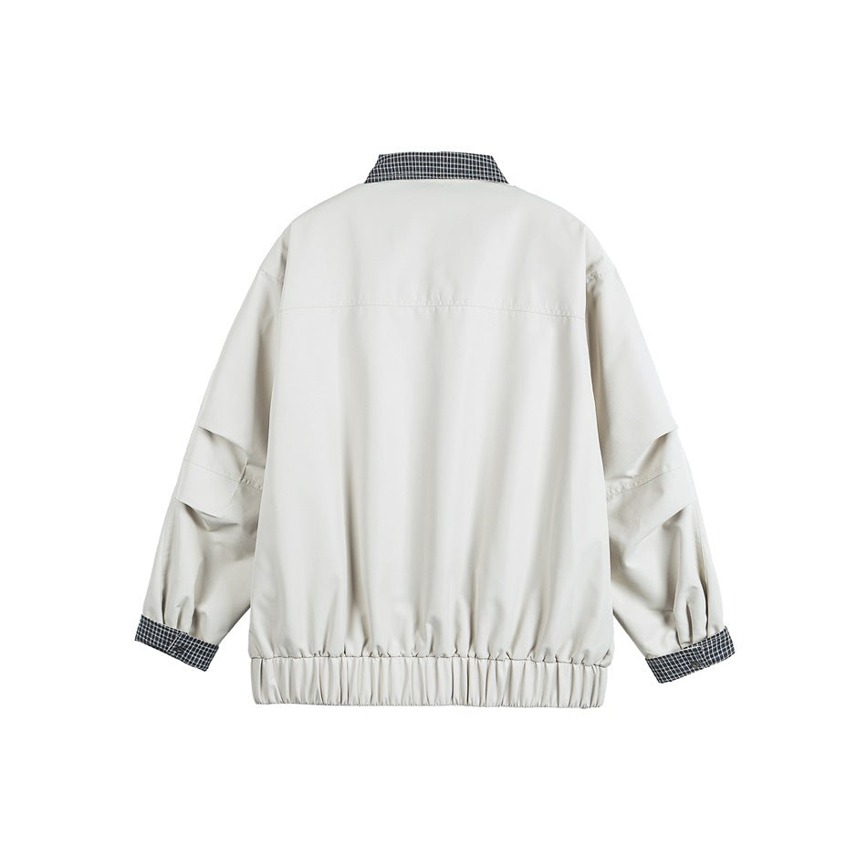 Back view of an off-white jacket with a checked collar and cuffs and an elasticized hem.