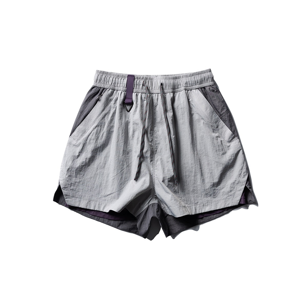 Flat-lay front of light gray shorts with dark gray side panels, purple tab and drawstring, and purple inner layer