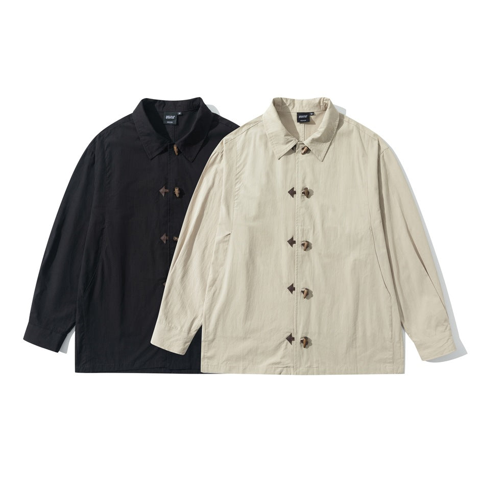 Two flat-lay views of a long-sleeved collared jacket with toggle closures, shown in black and light beige.