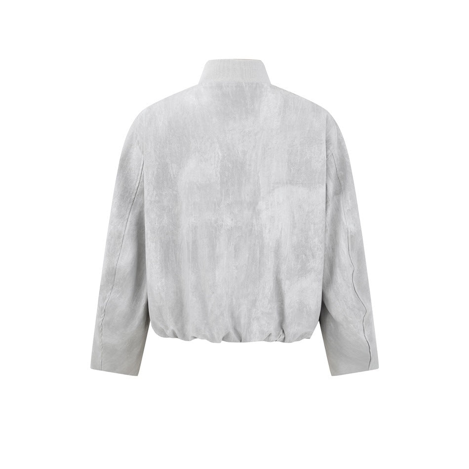 Back view of a light gray mottled jacket with a stand collar and long sleeves.