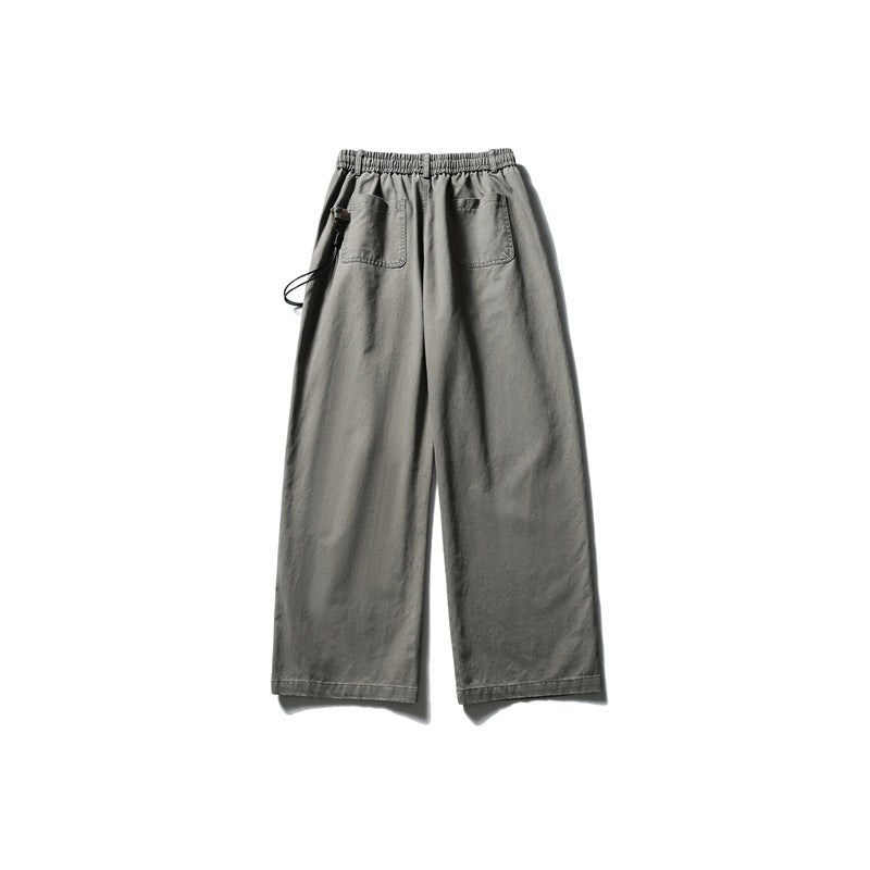 Back view of gray-green wide-leg pants with elastic waist and two patch back pockets