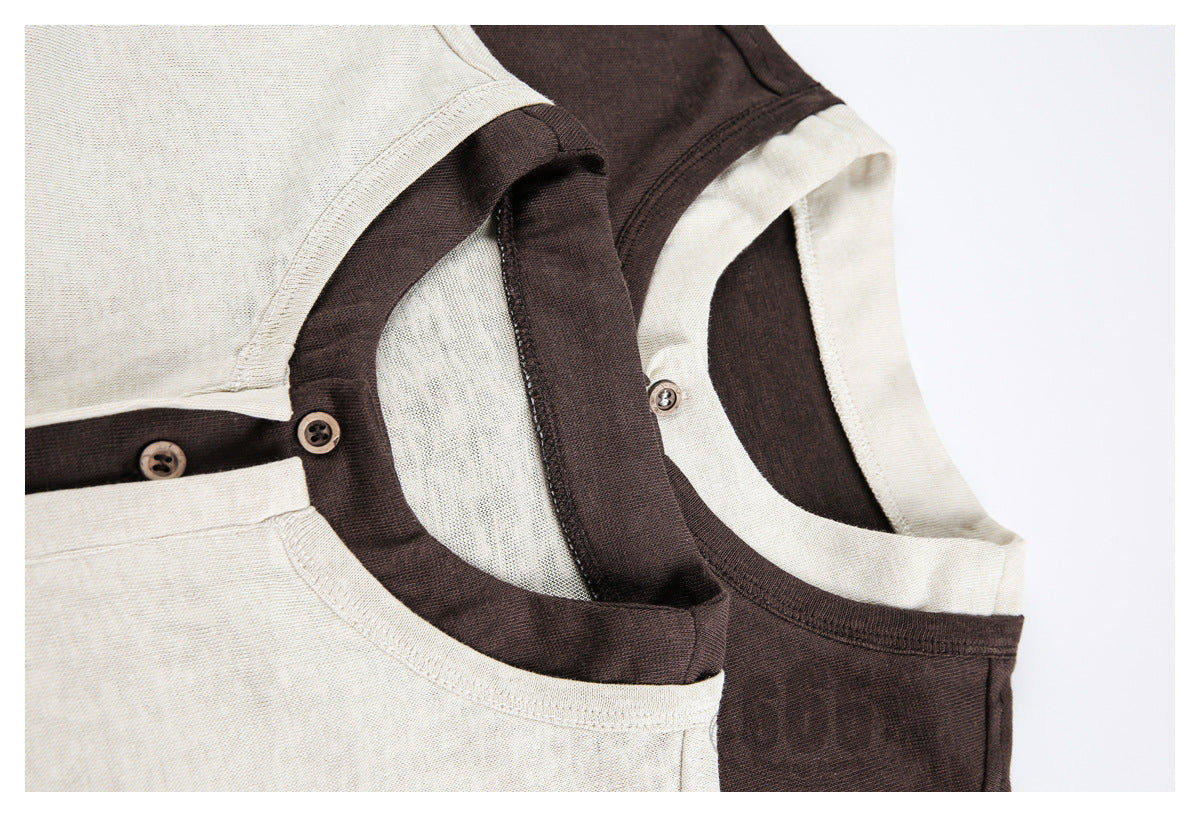 Close-up of overlapping cream and dark brown shirts showing contrasting necklines and button plackets.