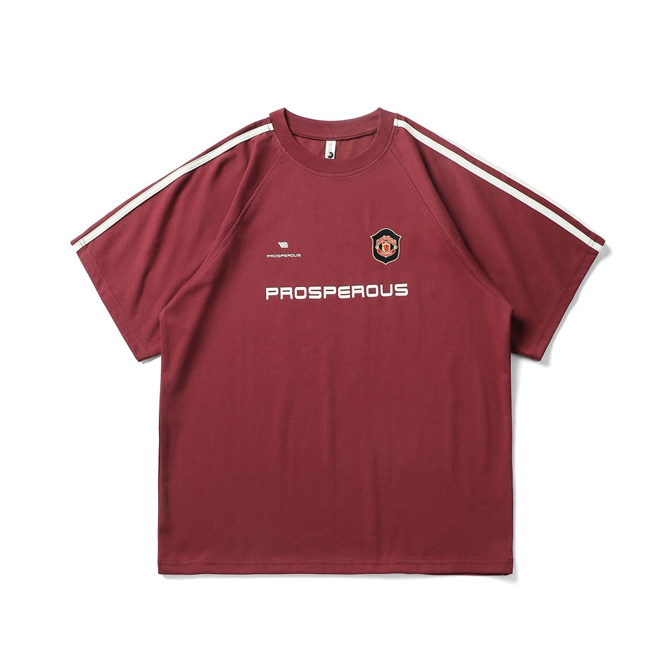 Burgundy short-sleeve raglan T-shirt with cream shoulder stripes, chest crest and PROSPEROUS print, front view
