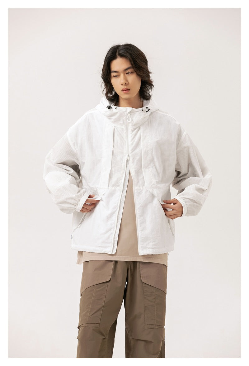 Model wearing a white hooded zip jacket with front pockets and a loose fit.