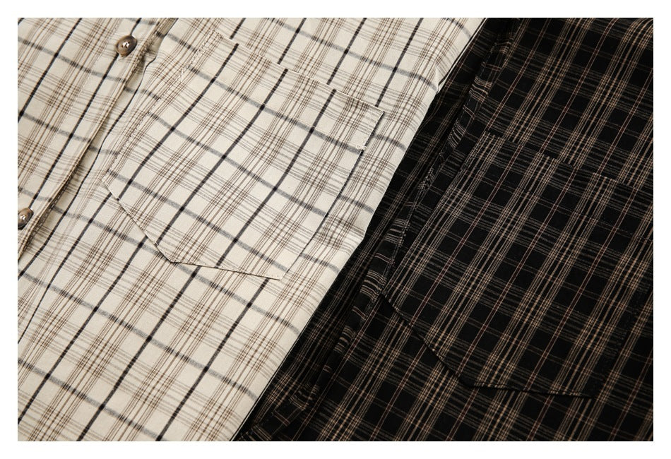 Close-up of cream and black plaid hooded shirts, showing their button fronts and chest pockets.