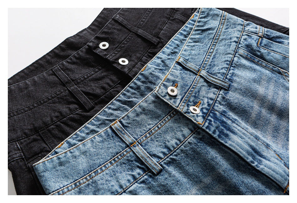 Close-up of black and light blue jeans showing buttoned waistbands, belt loops and contrasting stitching.