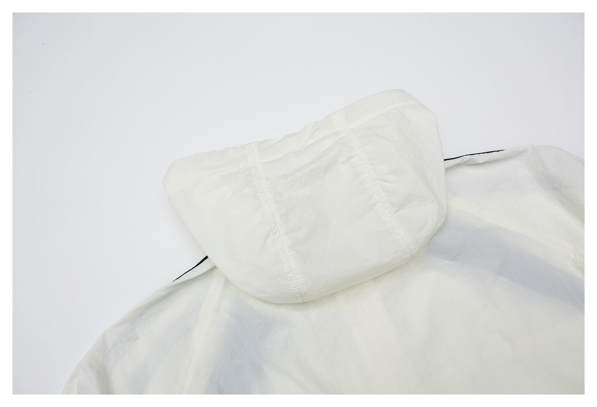 Close-up of a white hood and upper back of a garment, showing seams and subtle pinstripe texture.