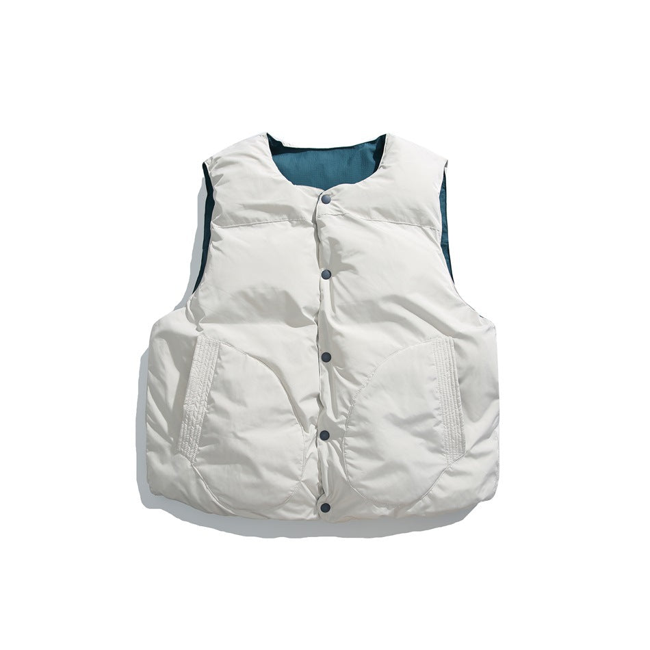 Cream sleeveless vest laid flat, with a dark teal inner collar, snap-front closure, and two large front pockets.