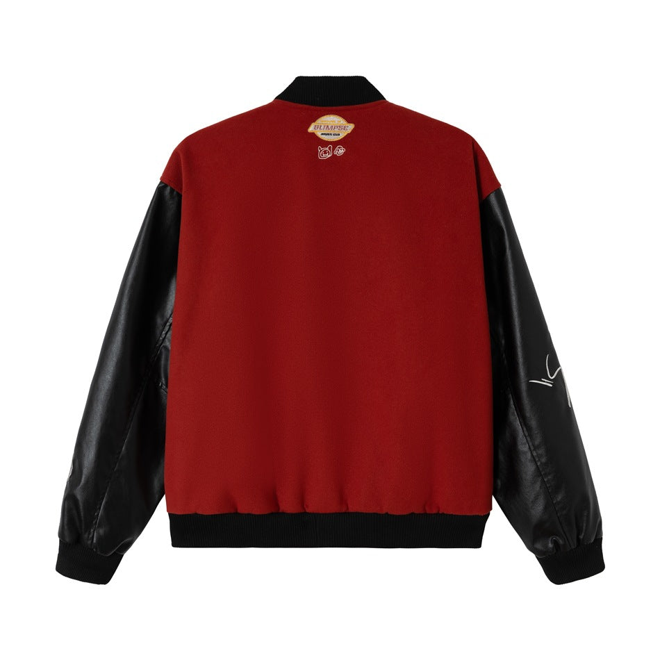 Back view of a red varsity jacket with black sleeves, ribbed black collar and cuffs, and a small upper-back label.