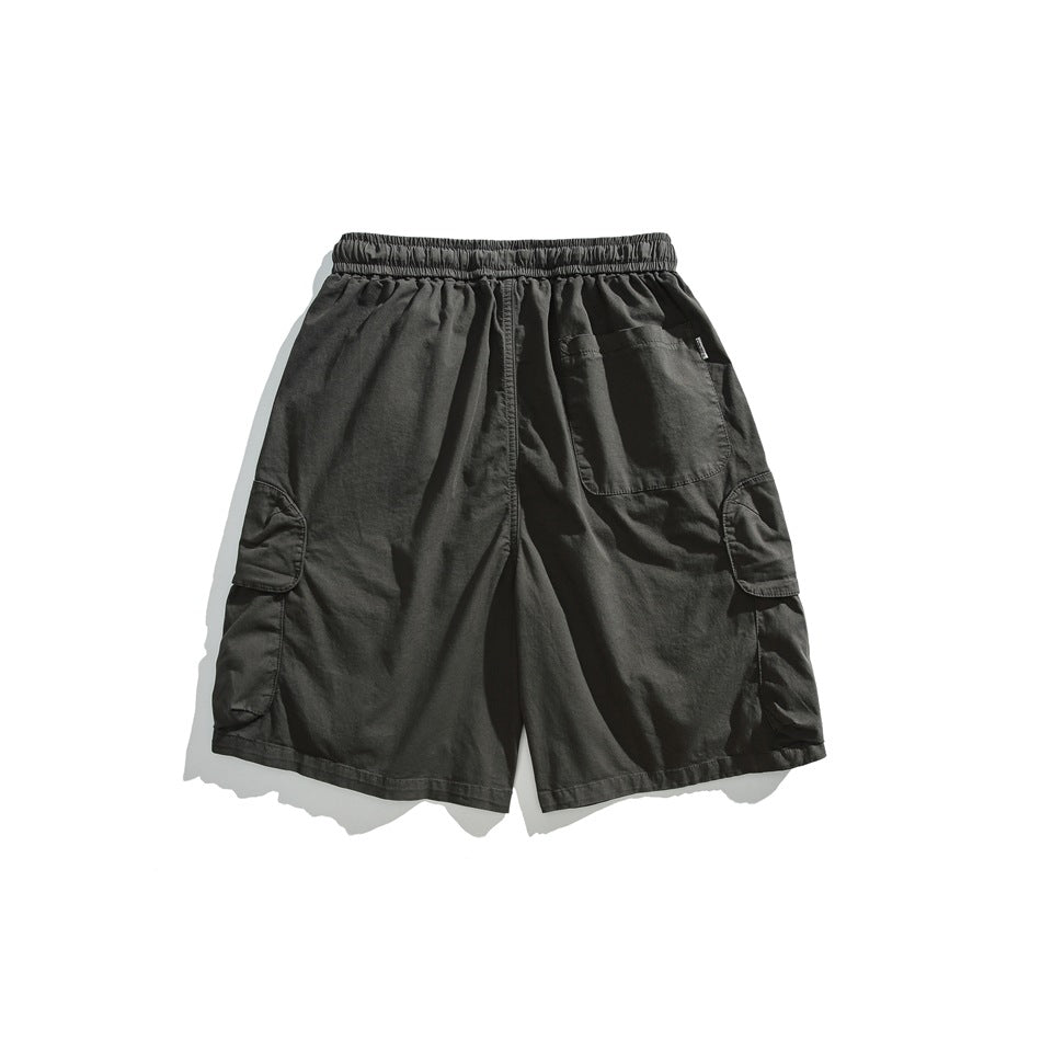 Back view of charcoal cargo shorts laid flat, with an elastic waistband, rear patch pocket, and side pockets.