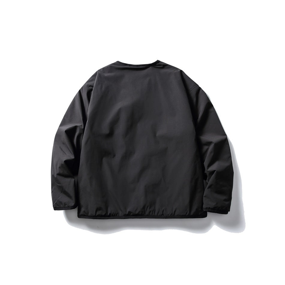 Back view of a plain black long-sleeved jacket laid flat against a white background.