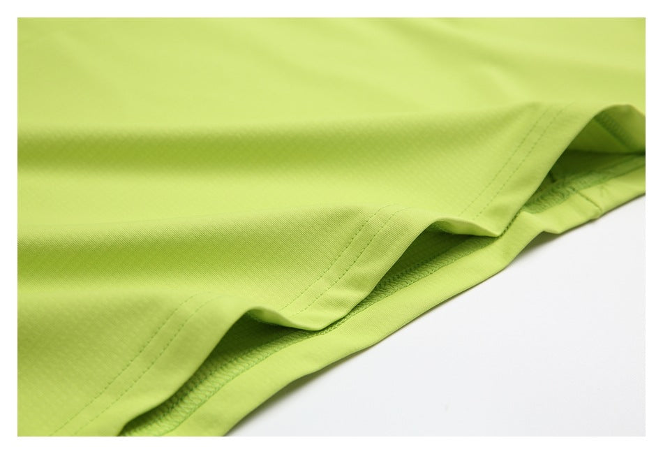 Close-up of a lime-green garment hem with visible stitching and a textured inner panel.