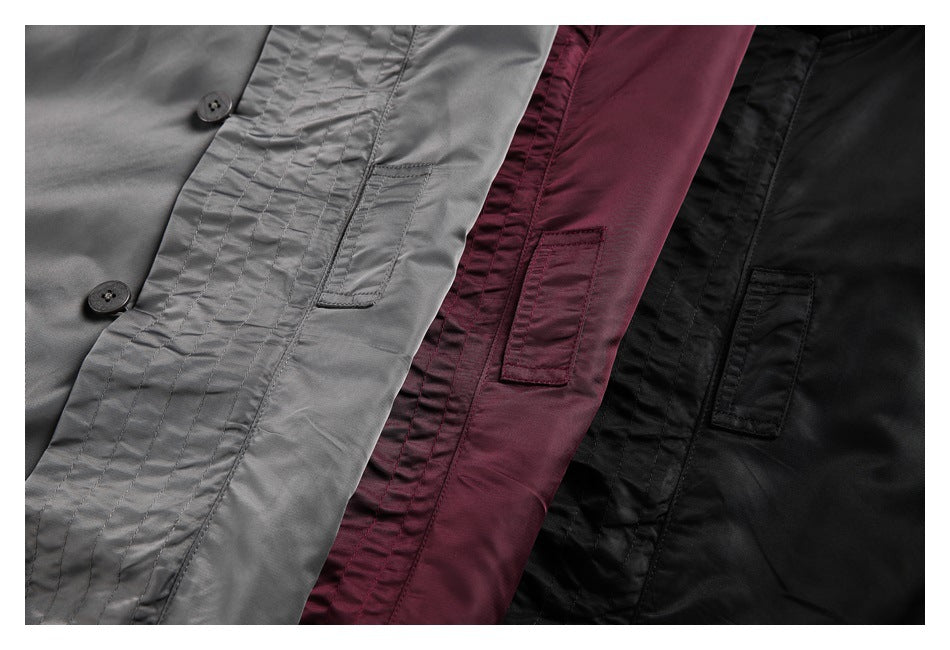 Gray, burgundy, and black jackets arranged together, with button fronts and small rectangular pockets visible.