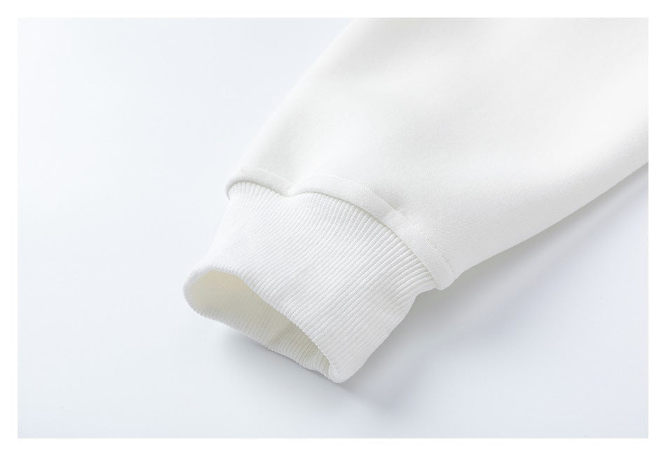 Close-up of a white sleeve ending in a wide ribbed cuff.