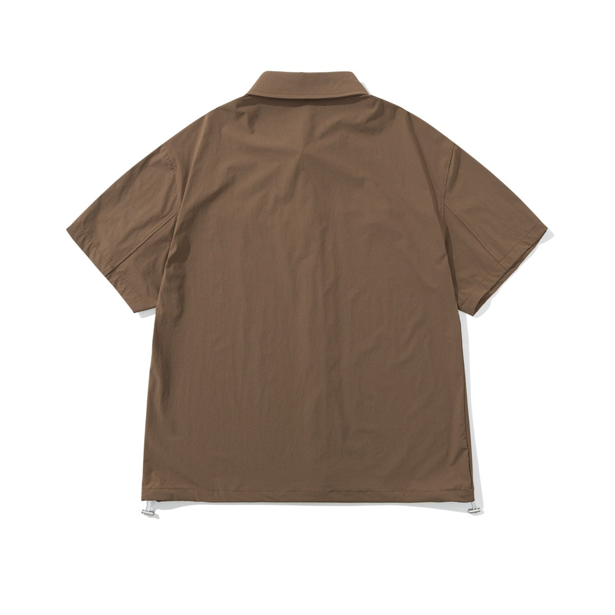 Back view of a brown short-sleeve collared shirt with a straight hem and drawcord toggles at the lower corners.