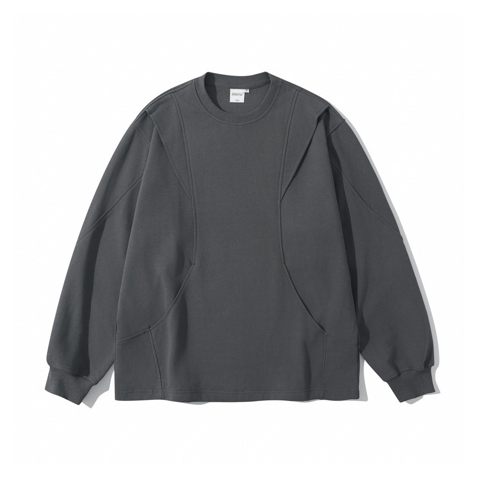 Dark gray long-sleeve crew neck pullover with curved seam panels and ribbed cuffs, shown flat from the front