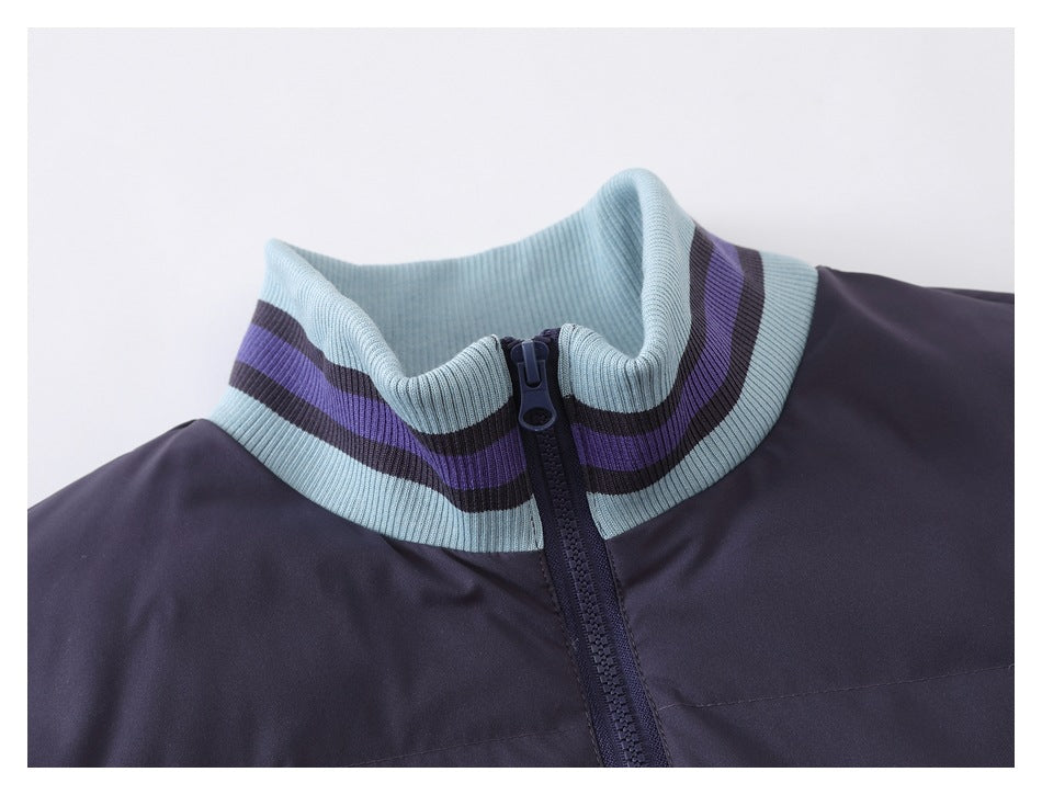 Close-up of a dark navy jacket's light blue ribbed stand collar with purple and dark stripes and a front zipper.