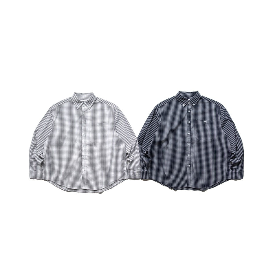 Two long-sleeve button-up shirts shown from the front, one light gray plaid and one dark navy plaid.