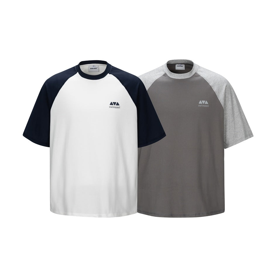 Two short-sleeve raglan T-shirts shown from the front: white with navy sleeves and charcoal with heather-gray sleeves.