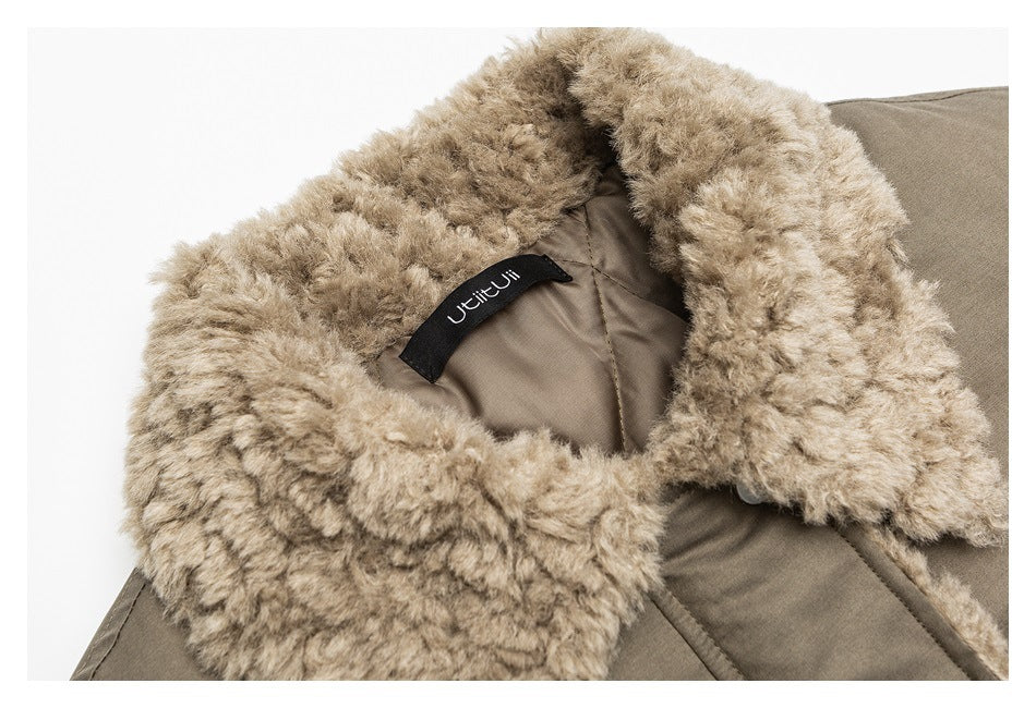 Close-up of a taupe jacket’s plush beige collar, lining, and sewn-in neck label.