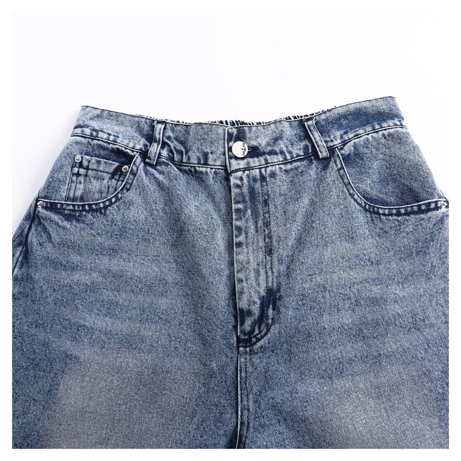 Front view of blue acid-wash jeans laid flat, showing the waistband, button, fly, and front pockets.