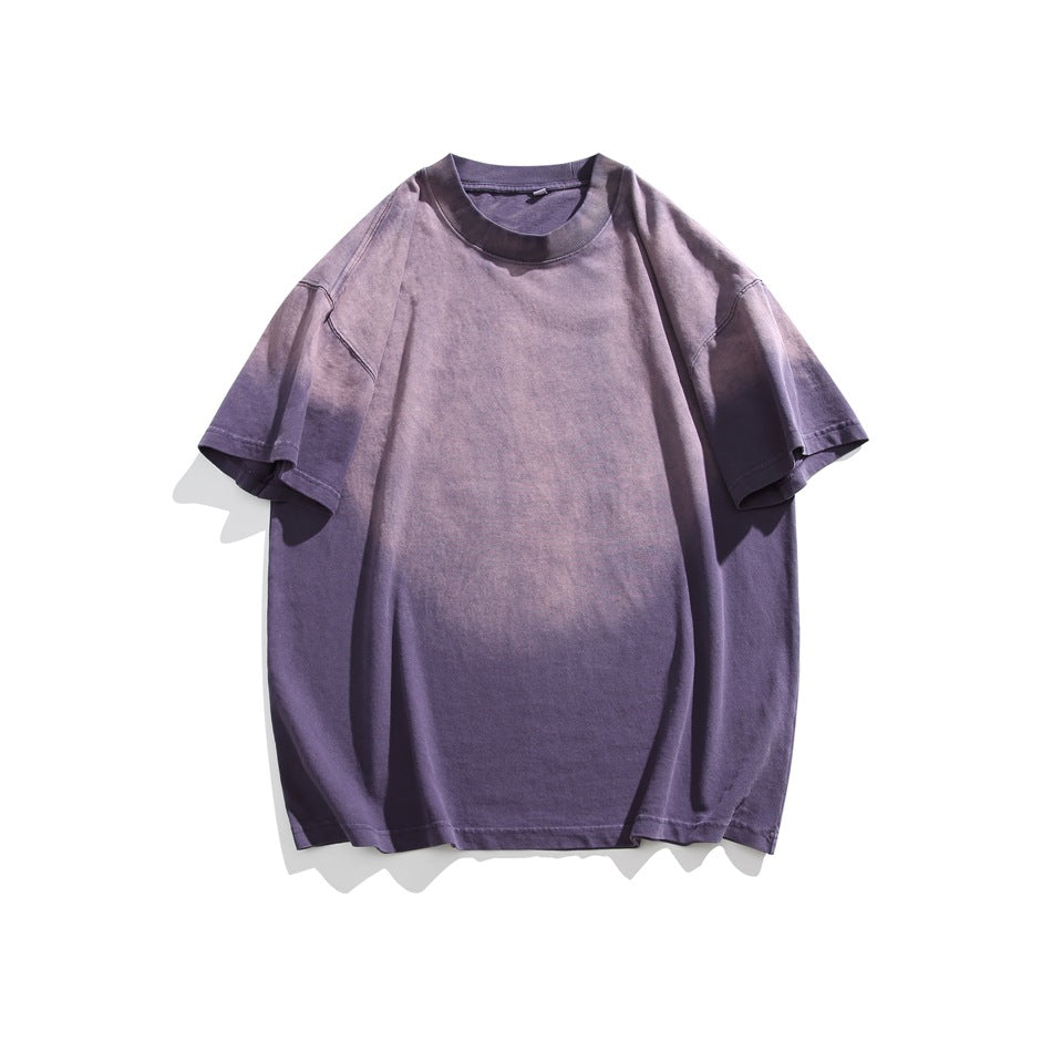 Purple short-sleeve crewneck T-shirt with pinkish faded gradient wash, flat lay front view