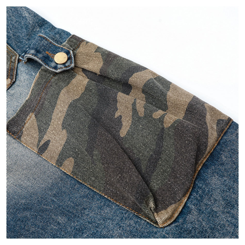 Close-up of a camouflage denim panel secured by a buttoned blue denim tab.