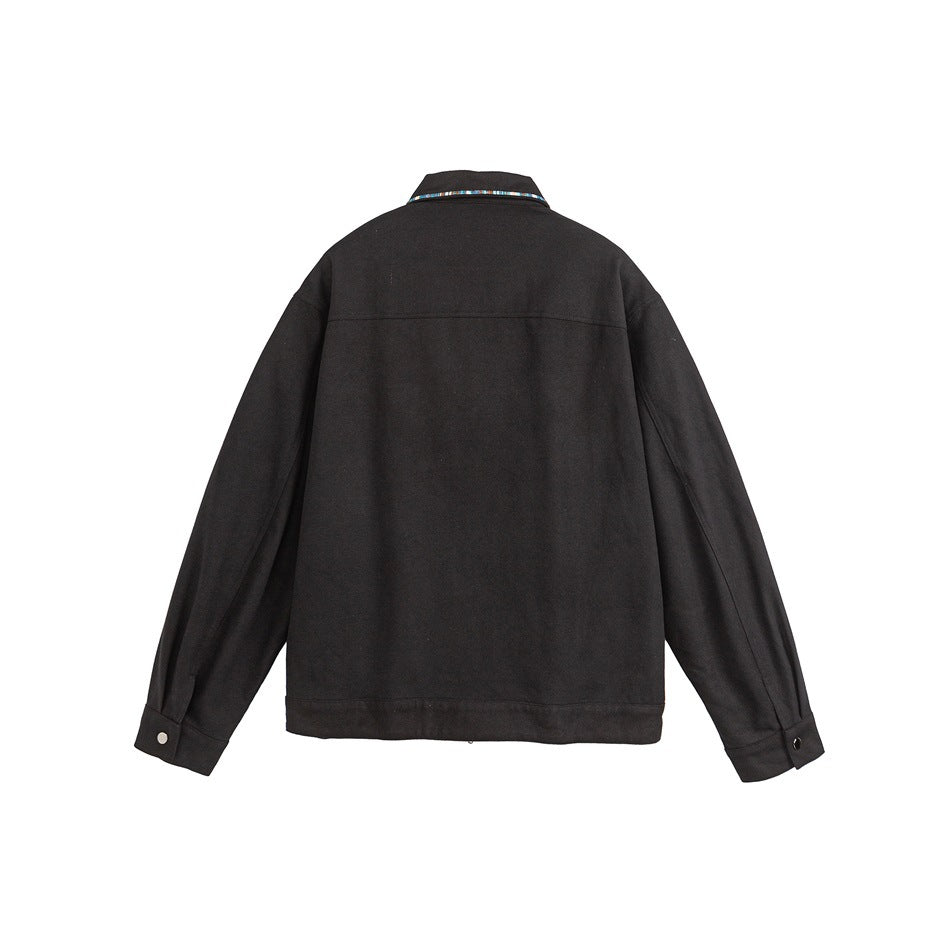 Back view of a black jacket with a multicolor patterned strip along the collar and buttoned cuffs.