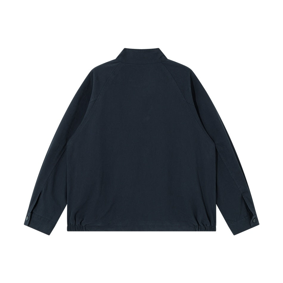 Back view of a dark navy jacket with a stand collar, raglan sleeves, and elasticized hem.