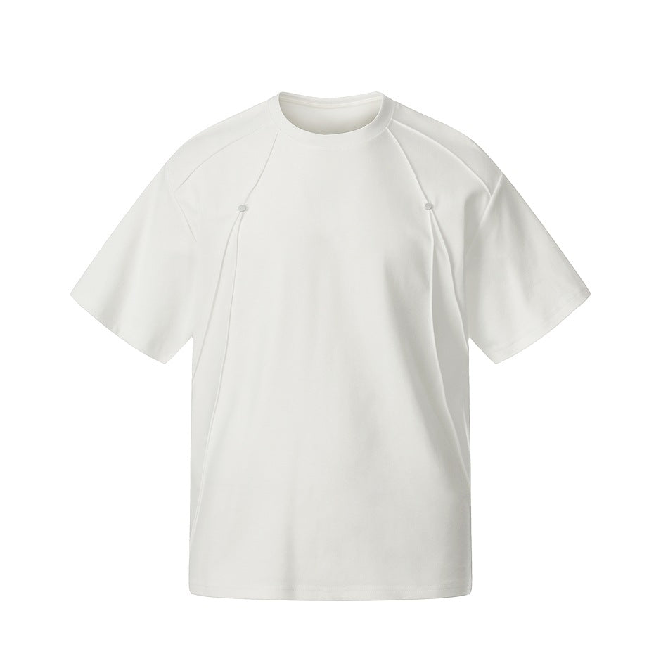 White short-sleeve crew-neck T-shirt with curved front seams and two small metal studs on the chest, flat front view