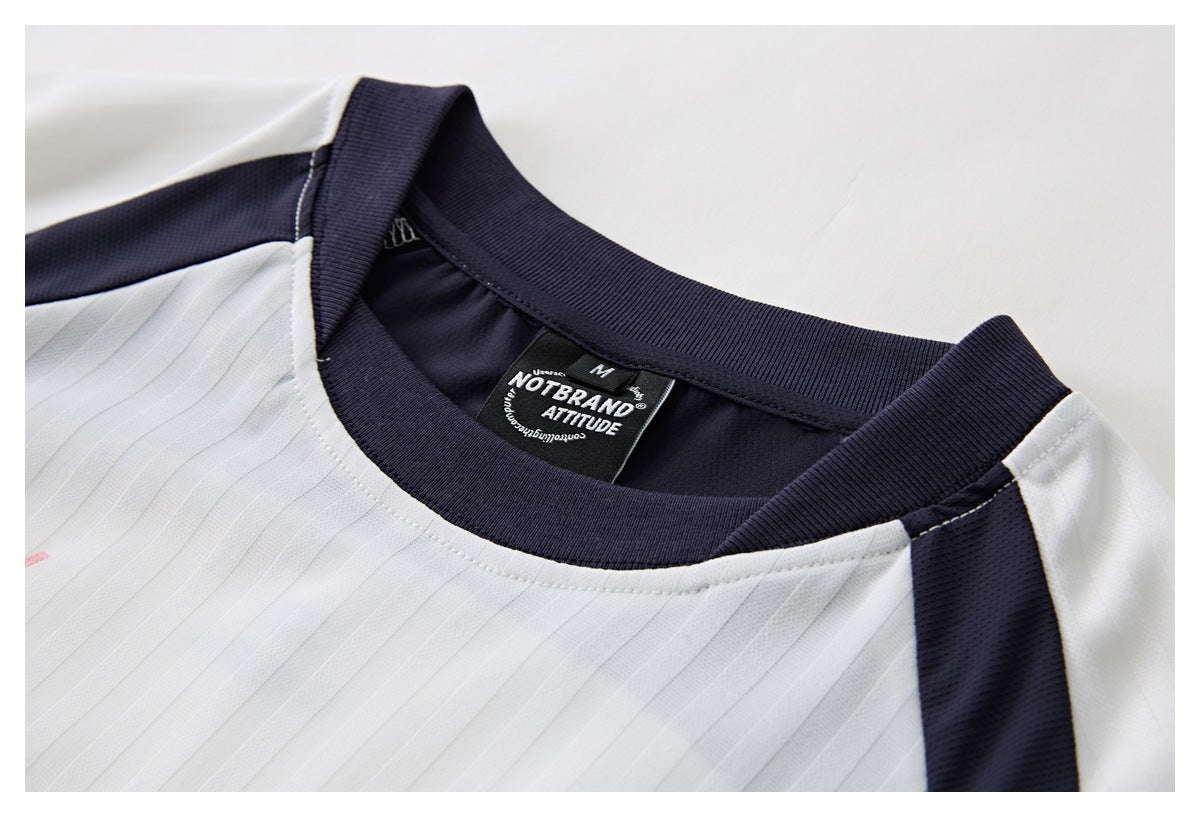 Close-up of the jersey neckline, showing its navy ribbed collar, white pinstriped fabric, and sewn label.