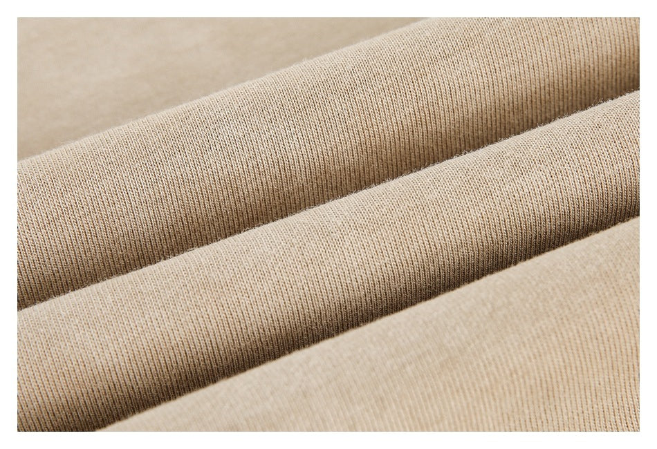Extreme close-up of beige ribbed knit fabric folds.