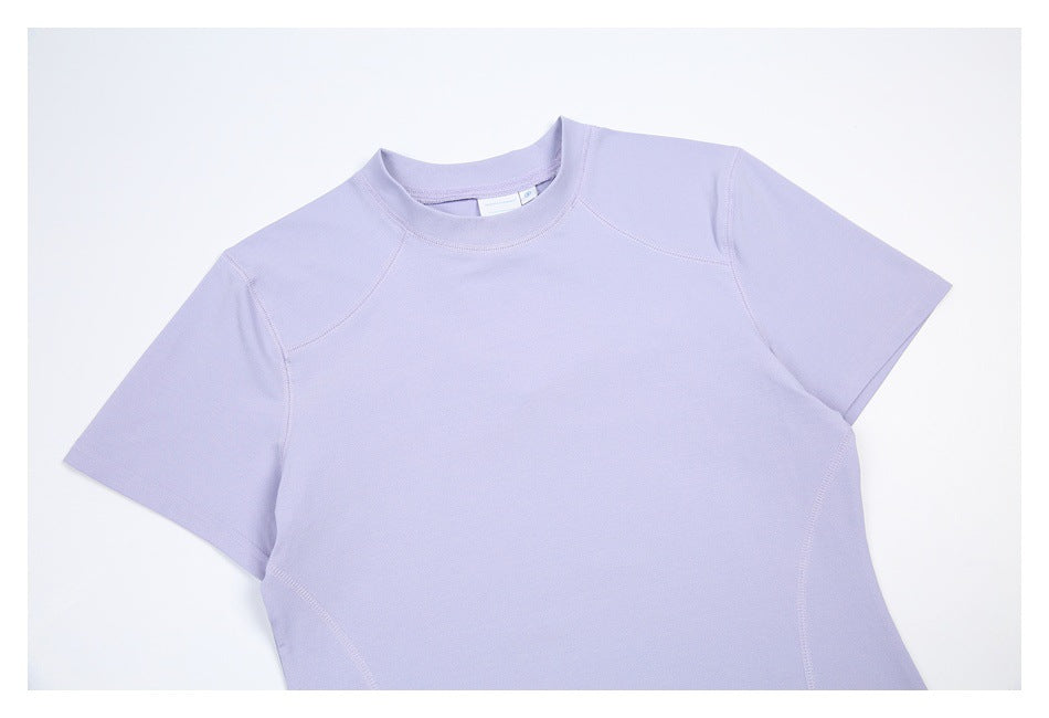 Cropped front view of a light lavender short-sleeve crew-neck shirt with curved shoulder seams.