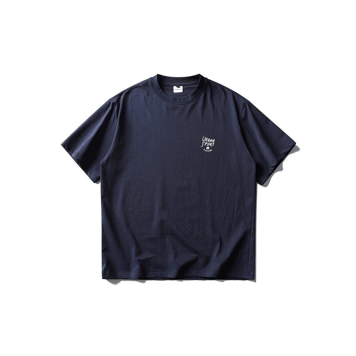 Navy blue short-sleeve crew-neck T-shirt flat lay with small white URBAN SPORT print on left chest