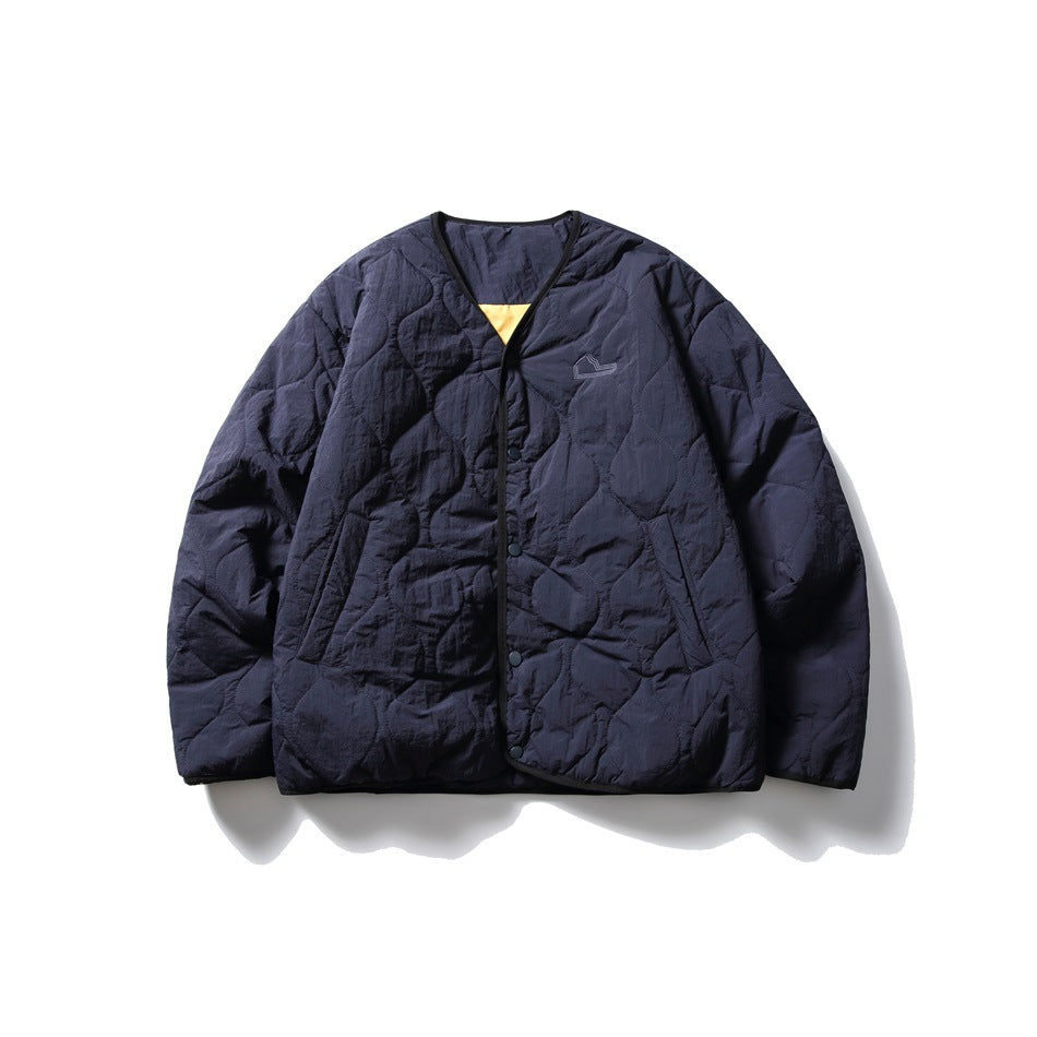 Navy blue quilted V-neck snap-front jacket with black trim, flat front view