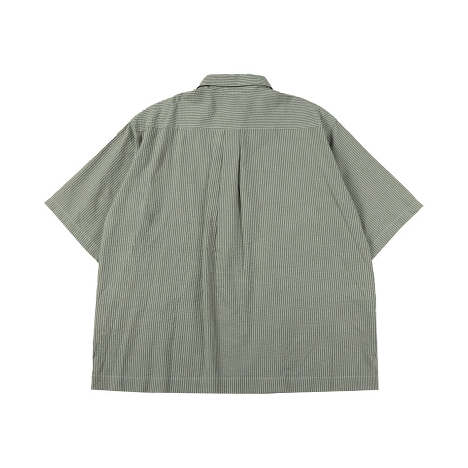 Back view of green striped short-sleeve shirt with yoke seam and center pleat