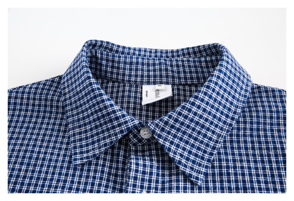 Close-up of the shirt's checked collar, top button, and interior size label.