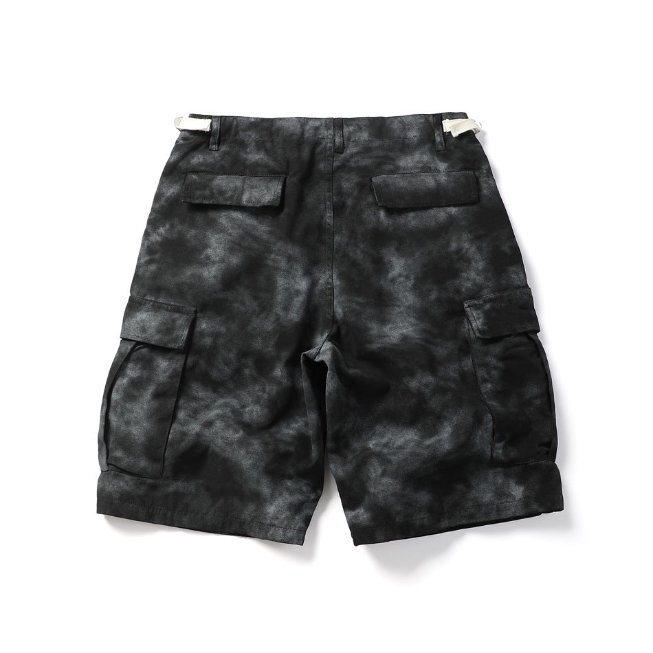 Black tie-dye cargo shorts, flat lay back view with two flap back pockets and side cargo pockets