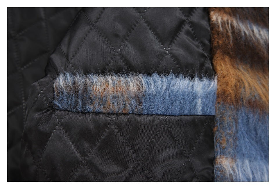 Close-up showing a fuzzy blue and brown plaid trim beside black diamond-quilted lining.