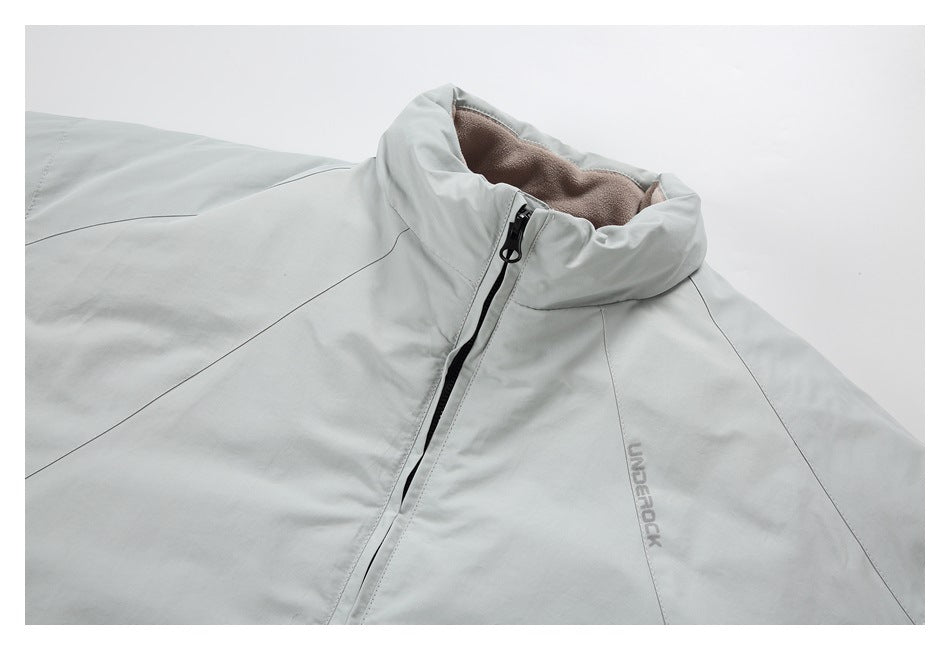 Close-up of a pale gray jacket collar, black front zipper, taupe lining, and subtle chest logo.