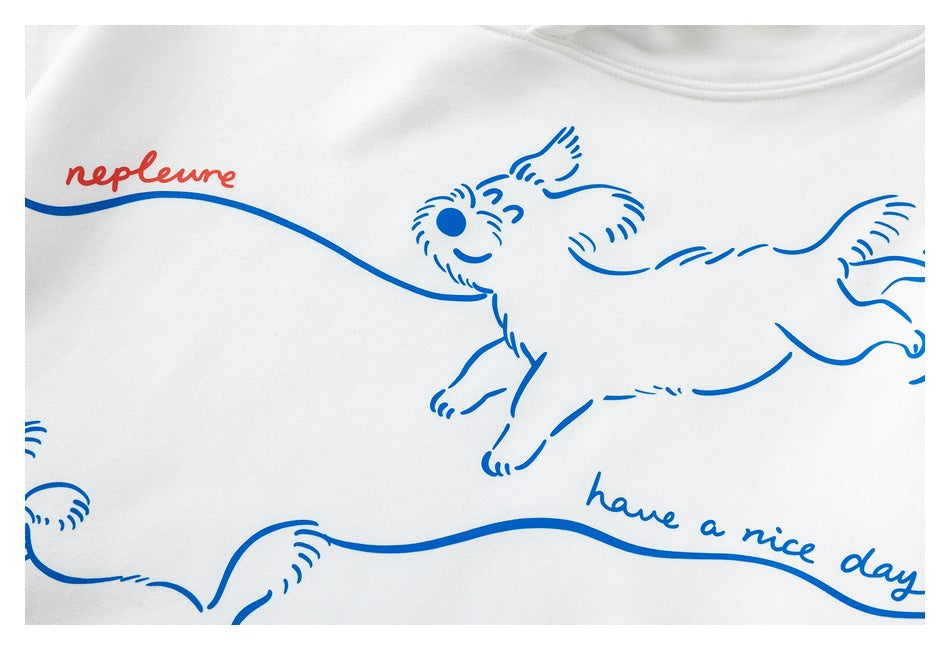 Close-up of the white sweatshirt’s blue running-dog graphic and “have a nice day” lettering.
